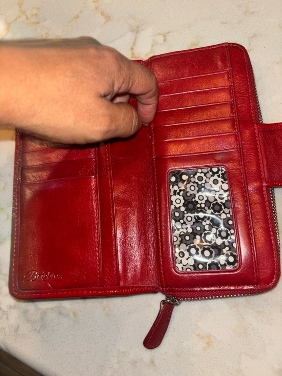 Brighton Red leather wallet featuring a decorative silver-toned snap closure. - Picture 12 of 16